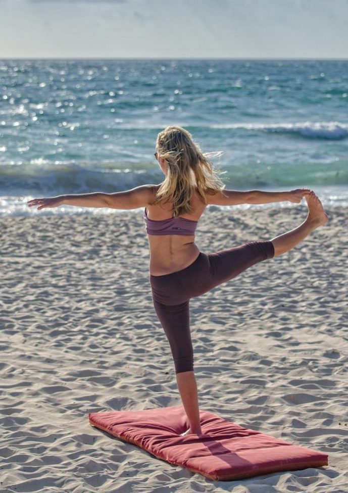 Image of yoga pose on the beach